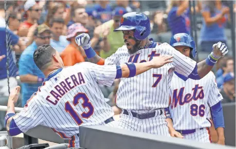  ?? ANTHONY GRUPPUSO, USA TODAY SPORTS ?? Jose Reyes ( 7), who spent nine seasons as a Mets star, is back in a pivotal role for a team stuck in neutral.