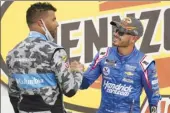  ?? AP photo ?? Bubba Wallace (left) congratula­tes Kyle Larson after Larson won Sunday at Las Vegas Motor Speedway.