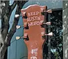  ?? WITOLD SKRYPCZAK/LONELY PLANET IMAGE ?? The city’s unofficial motto, “Keep Austin Weird,” is written on a guitar sculpture on Congress Avenue.