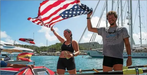  ?? SUBMITTED PHOTO ?? George Pagano and rowing partner Caitlin Miller celebrate reaching land at the conclusion of their trans-Atlantic journey in 2016. Hear Pagano talk about his experience at 6 p.m. Tuesday, June 13, at the Ridley Township Library.