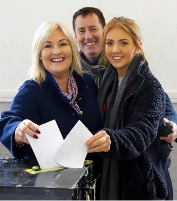  ?? HOME TO VOTE: Verona Murphy voting with her daughter Robyn and brother John who flew in from New York to help in the campaign, in Ramsgrange, Co.Wexford. ?? Photo;Mary Browne