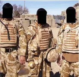  ??  ?? Risk: Afghan interprete­r Chris, centre, at work with UK soldiers. The men’s identities have been concealed for their own safety