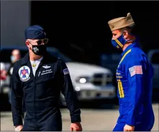  ?? PHOTO VINCENT OSUNA ?? Lt. Col. John Caldwell, commander/leader of the U.S. Air Force Thunderbir­ds, (left) speaks with Commander Brian C. Kesselring, of the U.S. Navy Blue Angels, on Wednesday at Naval Air Facility El Centro.