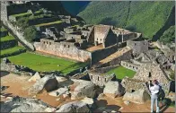  ?? REUTERS ?? A visitor takes photos at the Inca citadel of Machu Picchu in Cusco, Peru’s top tourist attraction.