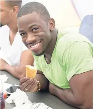  ??  ?? Javoy Sawyers is in a happy mood with his breadfruit fries.