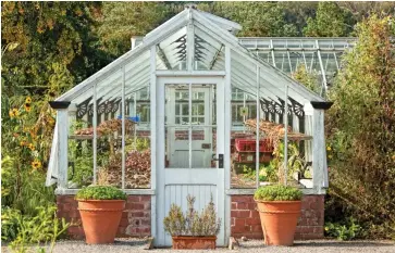  ??  ?? Safe haven: A greenhouse will protect fragile plants from adverse weather