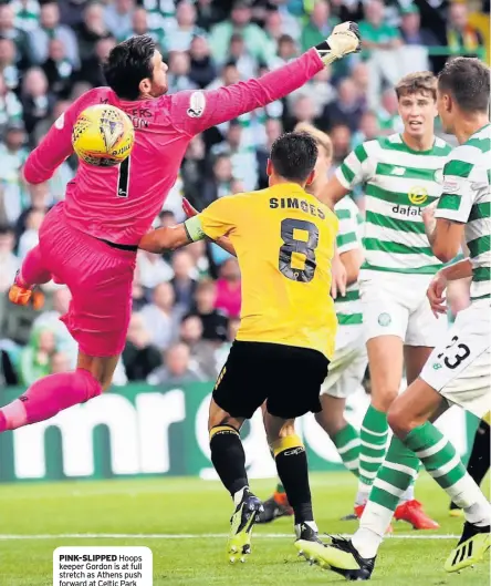  ??  ?? PINK-SLIPPED Hoops keeper Gordon is at full stretch as Athens push forward at Celtic Park