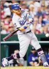  ??  ?? Los Angeles Dodgers’ Justin Turner connects for a single off Washington Nationals relief pitcher Austin Voth during the seventh inning of a baseball game, on July 2, in Washington. (AP)