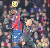  ??  ?? Crystal Palace's striker Christian Benteke (L) vies with Arsenal's midfielder Jack Wilshere during their EPL football match at Selhurst Park in London.