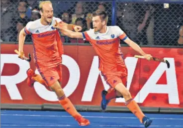  ?? ARABINDA MAHAPATRA/HT ?? ▪ Thierry Brinkman (right) celebrates his goal against India in their World Cup quarter-final in Bhubaneswa­r on Thursday.