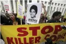  ??  ?? Protesters call for justice in the killing of Oscar Grant on 13 June 2011 at the US district court building in Los Angeles. Photograph: Nick Ut/AP