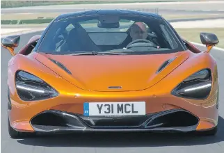  ?? PHOTOS: McLAREN ?? David Booth got behind the wheel of the 2018 McLaren 720S, which starts at $312,500.