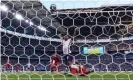  ?? Photograph: Alex Morton/Uefa/ Getty Images ?? Denmark captain Simon Kjaer inadverten­tly steers an equaliser for England into his own net under pressure from Raheem Sterling.