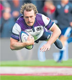  ??  ?? CAPTAIN’S CALL: Stuart Hogg in full flow as he touches down for Scotland