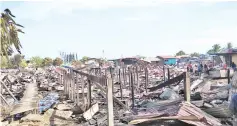  ??  ?? The aftermath of the fire at Pasir Putih Putatan where about 60 families were left homeless.