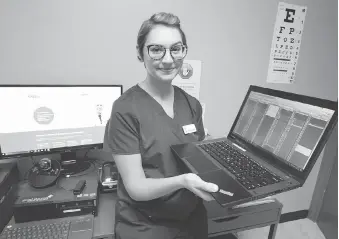  ?? NICK BRANCACCIO ?? Registered nurse Victoria Rybaczuk prepares for the next patient at the Good Doctors Walk-In Clinic on Tecumseh Road West on Wednesday. Rybaczuk takes initial informatio­n before a physician from Toronto enters the picture via a video screen. The clinic...