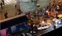  ?? — AFP ?? A photo grab raleased on Monday shows a group of men blocking traffic in a street in Tehran on Saturday.