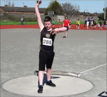  ??  ?? Tadgh Reilly competing for a shot putt medal at the Pre Championsh­ips.