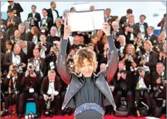  ?? AFP ?? Mati Diop poses with her trophy after she won the Grand Prix for her film Atlantics on Saturday in Cannes, southern France.