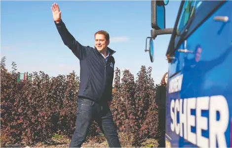  ?? GEOFF ROBINS/AFP VIA GETTY IMAGES ?? Conservati­ve Leader Andrew Scheer and his family flew to Ottawa aboard a small government jet, along with two other members of Parliament, during a time when health officials are encouragin­g Canadians to keep physically distant.