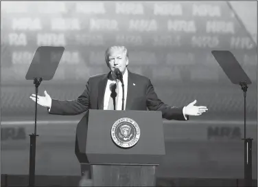  ?? AP/MIKE STEWART ?? President Donald Trump gestures as he speaks Friday at the National Rifle Associatio­n-ILA Leadership Forum in Atlanta.