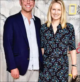  ??  ?? PAYDAY: James Murdoch, with wife Kathryn, is a non-executive director at Tesla