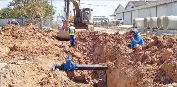  ?? PENH WATER SUPPLY AUTHORITY PHNOM ?? Workers connect a water supply system in Prey Sar commune in the capital’s Dangkor district last year.