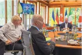  ?? KENNY HOLSTON/POOL VIA AP ?? Ukraine President Volodymyr Zelenskyy appears on screen to address the G7 leaders via video link during their working session at Castle Elmau in Germany.