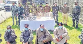  ?? ANI ?? The arrested militants and their associates in Jammu and Kashmir Police custody on Friday.