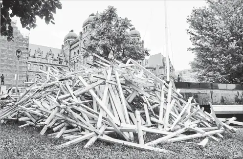  ?? FRANK GUNN THE CANADIAN PRESS ?? Wooden crosses representi­ng the 1,265 Ontarians who lost their lives in 2017 to overdoses are placed on the lawn as a sign of protest at Queen’s Park in Toronto, Oct.1.