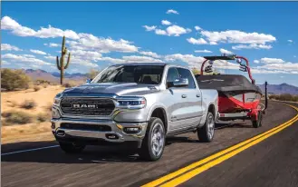  ?? Courtesy of Fiat Chrysler Automobile­s North America via AP ?? This undated photo provided by Fiat Chrysler Automobile­s North America shows the Ram 1500, which was redesigned for 2019 with upgraded technology, and increased towing and hauling ability.