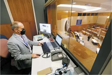 ?? LUIS SÁNCHEZ SATURNO/THE NEW MEXICAN ?? Chris Nordstrum, the Senate Democrats’ communicat­ions director, works Tuesday in his office at the State Capitol. ‘I really do see my job as to provide that conduit to everyone in the media to get everything they need,’ he says.