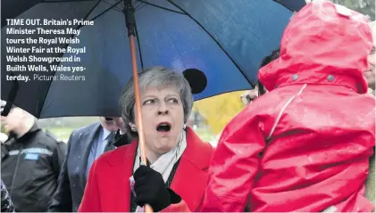  ?? Picture: Reuters ?? TIME OUT. Britain’s Prime Minister Theresa May tours the Royal Welsh Winter Fair at the Royal Welsh Showground in Builth Wells, Wales yesterday.