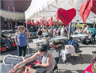  ??  ?? Remembranc­e messages appear on hearts at the Moms Stop the Harm booth at Internatio­nal Overdose Awareness Day in Centennial Square. Hundreds of people attended the rally.