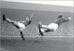  ??  ?? Leyton Orient’s goalkeeper David Groombridg­e punches clear during an FA Cup tie against Liverpool in January 1959