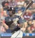  ?? Chris Szagola / AP ?? Atlanta’s Brandon Phillips singles knocks in a run during the sixth inning of Monday’s game against Philadelph­ia.