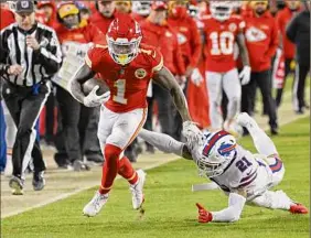  ?? Reed Hoffmann / Associated Press ?? Buffalo free safety Jordan Poyer tries to tackle Kansas City’s Jerick Mckinnon. Big plays by the Chiefs down the stretch were the difference.