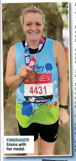  ?? ?? FUNDRAISER: Emma with
her medal.