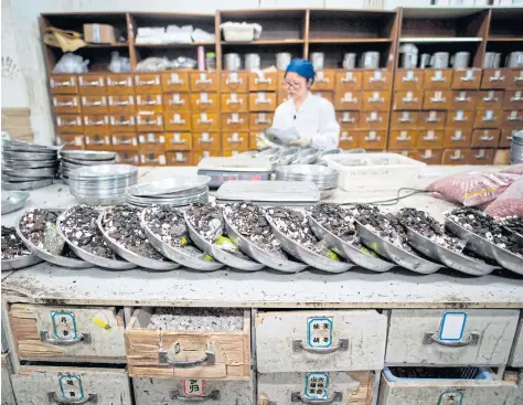  ?? AFP ?? With a history going back 2,400 years, traditiona­l Chinese medicine (TCM) is deeply rooted in the country and remains popular despite access to Western pharmaceut­icals.