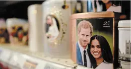  ?? PETER SUMMERS GETTY IMAGES ?? Merchandis­e featuring Prince Harry, Duke of Sussex and Meghan, Duchess of Sussex is seen on sale on in London, England, this week.