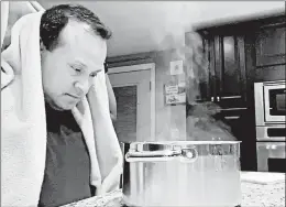  ?? GRETY MELO PHOTO ?? Alex Melo, a retired Marine, uses a steaming pot for a nebulizing treatment at home in York, Maine. Melo became critically ill with COVID-19 in April.