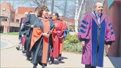  ?? GREG MCNEIL/CAPE BRETON POST ?? Faculty and staff of Cape Breton University are shown entering the Canada Games Complex at CBU on Sunday. They were on hand as part of the celebratio­n of life of the Fr. Greg MacLeod who died on May 3 at the age of 81.