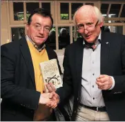  ??  ?? Dr Declan Downey congratula­tes Pat Neligan on the launch of his book ‘The Knave of Trumps’ in Benner’s Hotel on Sunday and (right) Pat signs a copy for past pupil John Benny Moriarty.