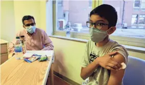  ?? COURTESY CINCINNATI CHILDREN’S HOSPITAL MEDICAL CENTER ?? Twelve-year-old Abhinav is one of the first children to join a COVID-19 vaccine trial. He got his shot on Oct. 22, the same day his father, Sharat, also joined the trial.