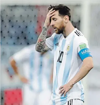  ?? PETR DAVID JOSEK THE ASSOCIATED PRESS ?? Argentina’s Lionel Messi reacts after the third goal by Croatia during a Group D match at soccer’s 2018 World Cup in Nizhny Novgorod, Russia, on Thursday. Croatia won the contest convincing­ly, 3-0.