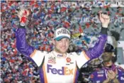  ?? AP PHOTO/JOHN RAOUX ?? Denny Hamlin celebrates in victory lane after winning the Daytona 500 on Monday in Daytona Beach, Fla.