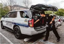  ?? Raquel Natalicchi­o/staff photograph­er ?? Nicholas He, 22, a biology student at Rice University, prepares the Rice EMS emergency vehicle.