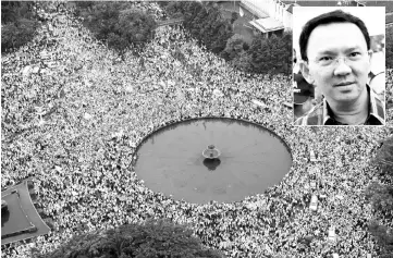  ??  ?? Members of Muslim groups attend a protest against Purnama in Jakarta, Indonesia. (Inset) Basuki Tjahaja Purnama. — Rueters photo