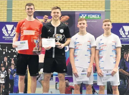  ??  ?? Champions Alex Dunn (second left) and Adam Hall won the men’s doubles title for a third successive time