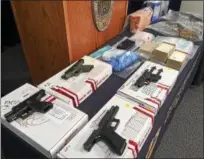  ?? CARL HESSLER JR. — DIGITAL FIRST MEDIA ?? Montgomery County authoritie­s displayed the guns and drug parapherna­lia that were seized during “Operation Poison Control” in Pottstown.